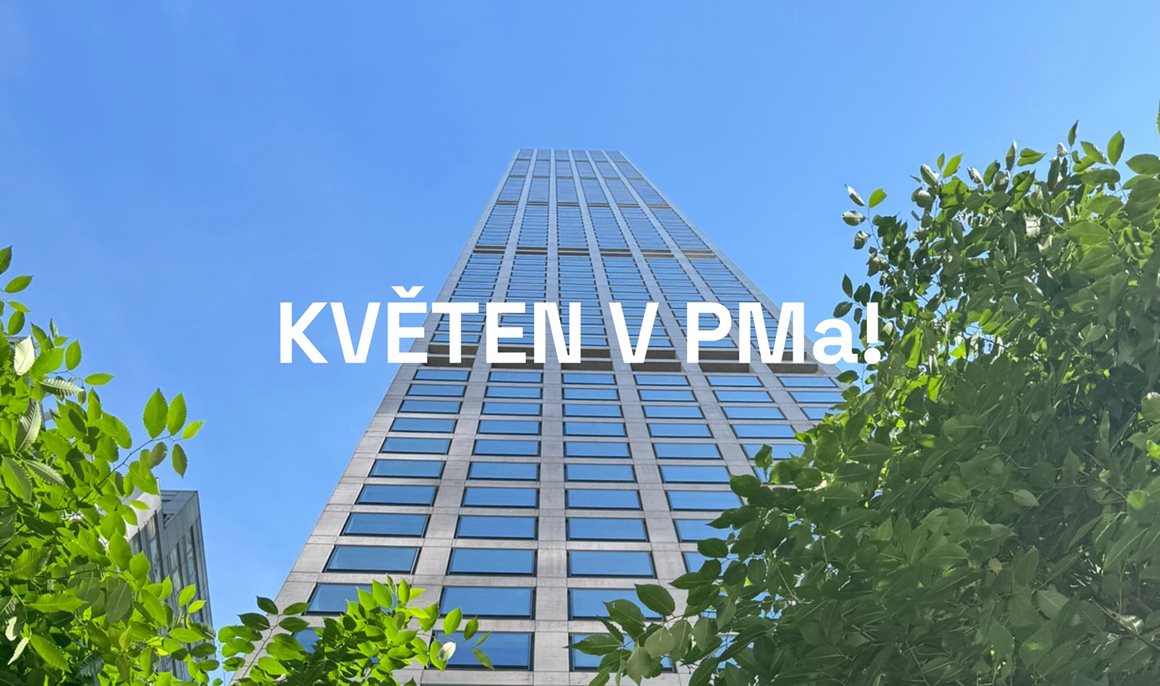 Tall glass office tower seen from ground level, framed by green trees against a blue sky; white overlaid caption reads 'KVĚTEN V PMa!'